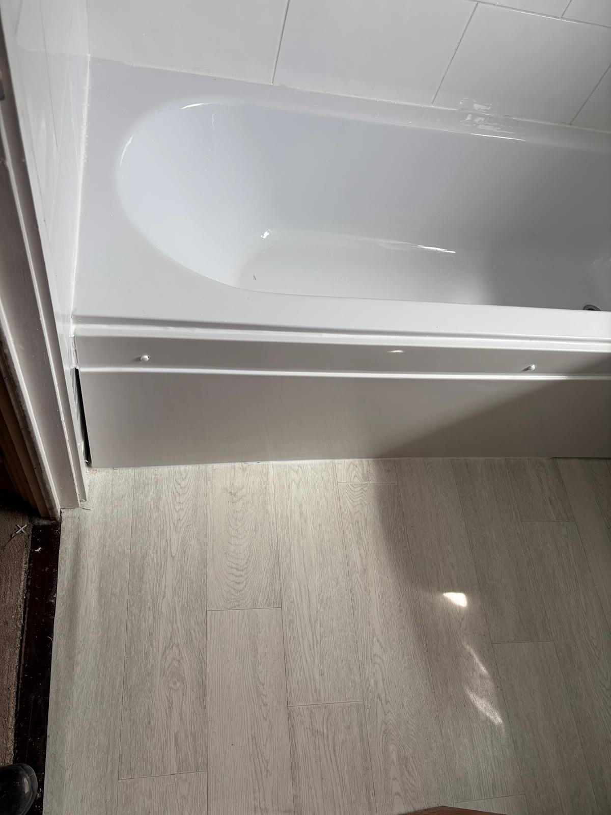 New bath and side panel with wood-effect flooring